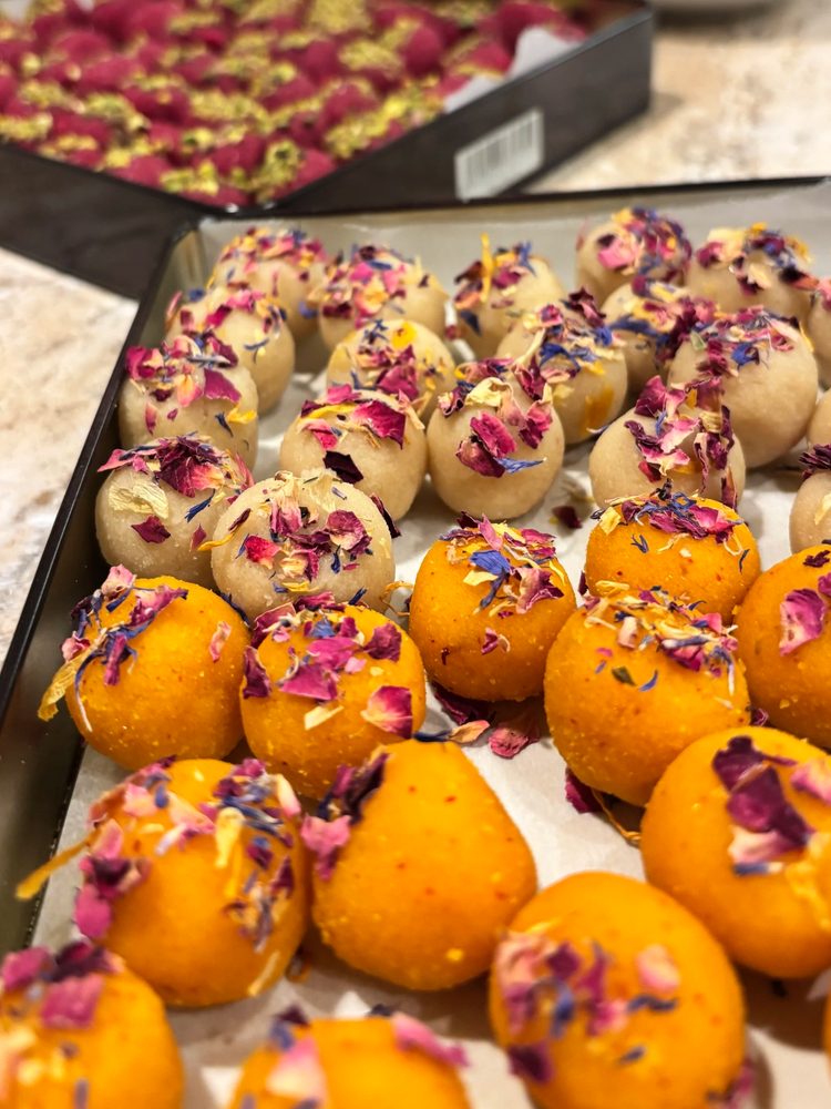 Saffron cookies dusted with dried rose petals and pistachio
