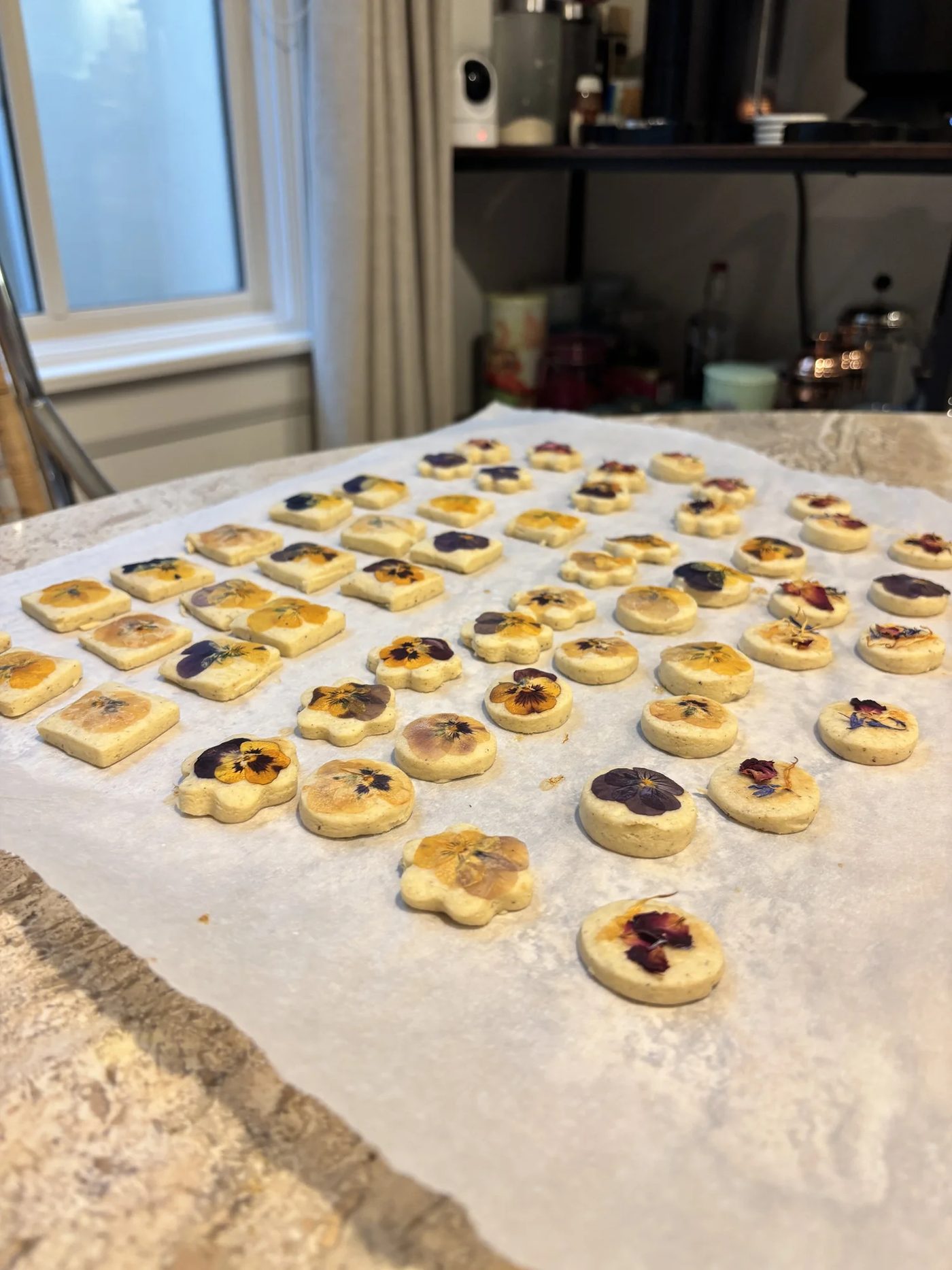 Trays of shortbread cookies pressed with edible pansies