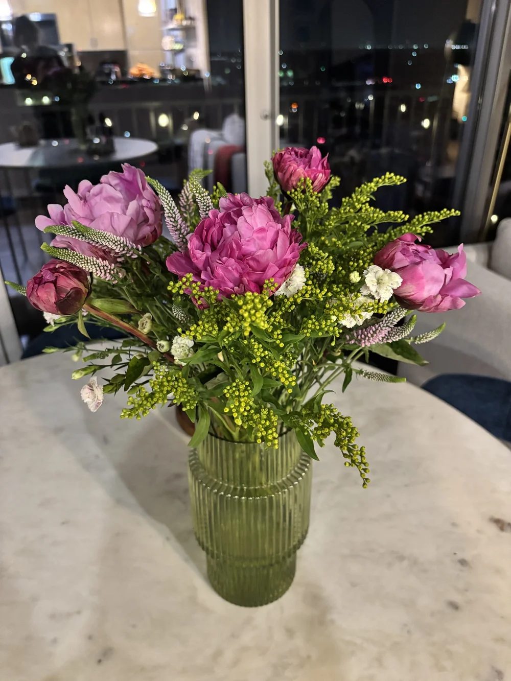 Pink peonies and veronica in a ribbed green vase